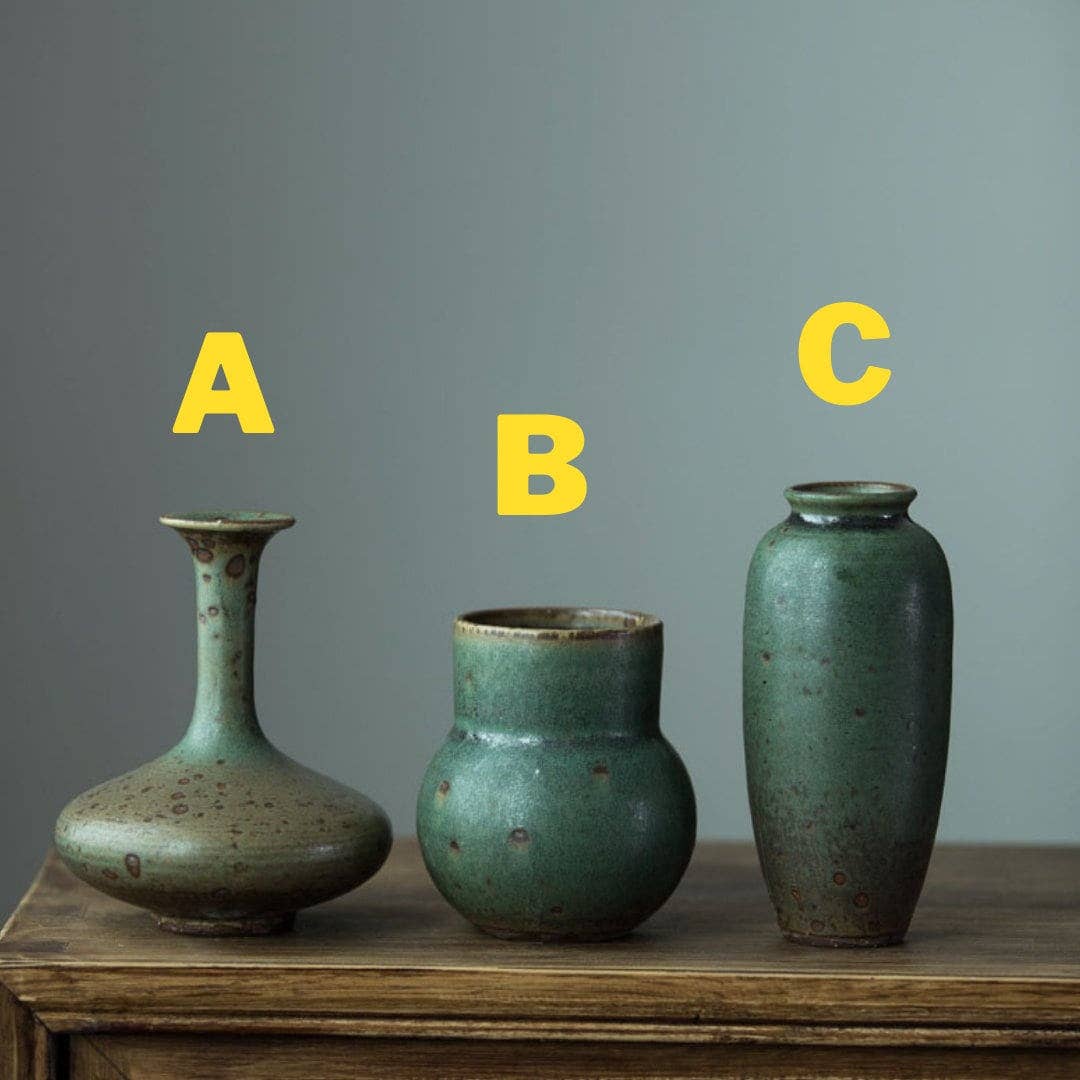 three vases sitting on top of a wooden table