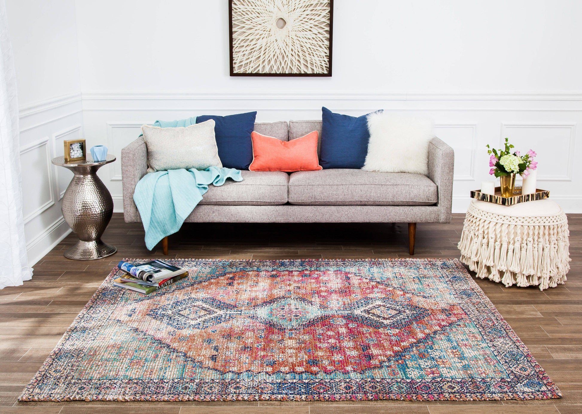 a living room with a couch and a rug